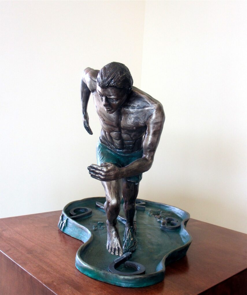 bronze sculpture of a running man