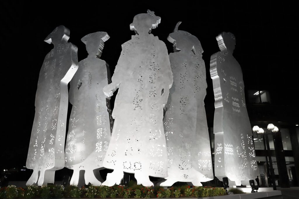 Final Suffragette Sculpture  installed in Lexington, Kentucky at night with lights
