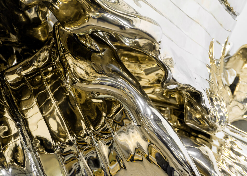 Close up on high polished bronze statue
