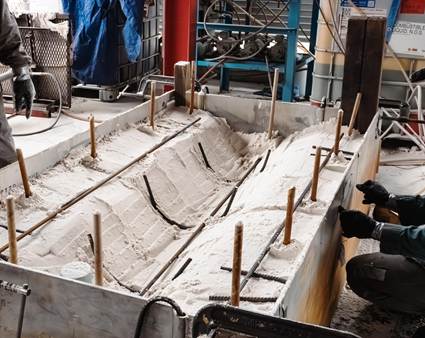 Sand mold used to cast the arms and legs of the playground