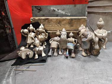 Small figures cast from traditional molds that are placed in the playground.