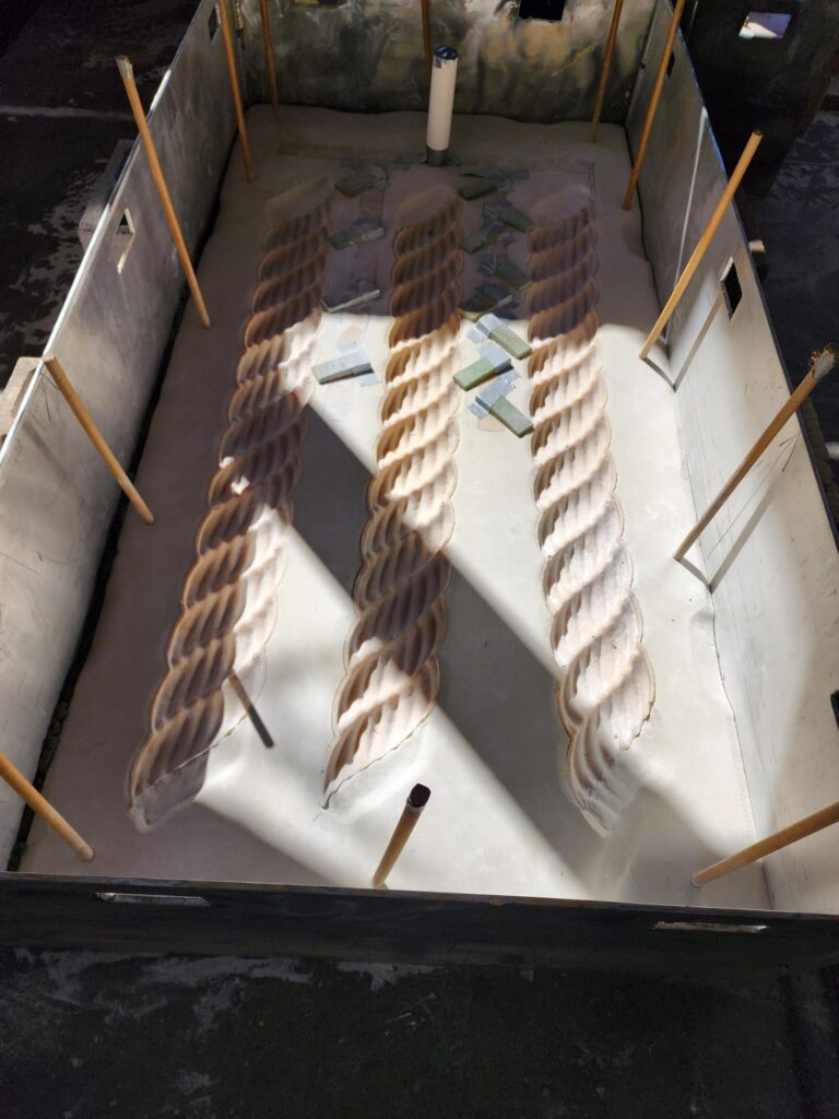 A sand mold layout made from the rope form rapid prototypes.