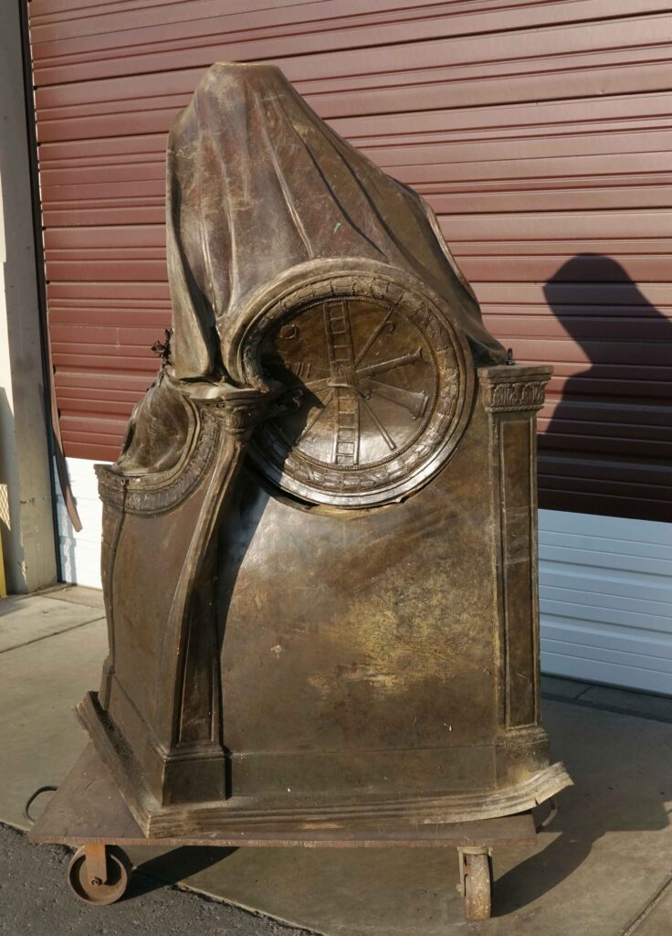 Back view of sculpture showing damage to the form.