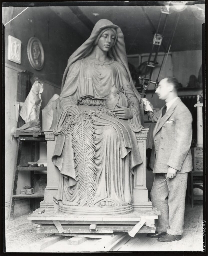 Scan of a historic photo of the Firefighter’s Memorial in the sculptor’s studio.
